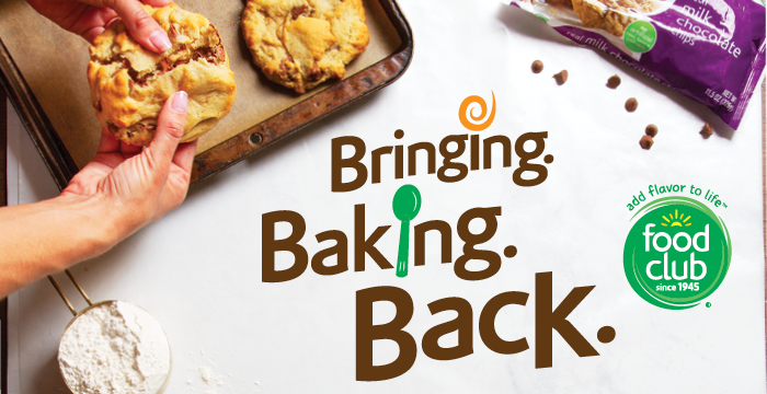 Bringing Baking Back A pair of hands breaks apart a gooey chocolate chip cookie.