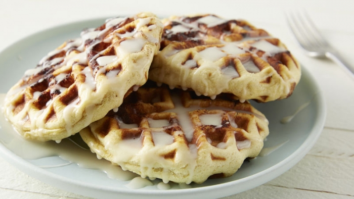 Plate of Cinnamon Roll Waffles with Cream Cheese Glaze
