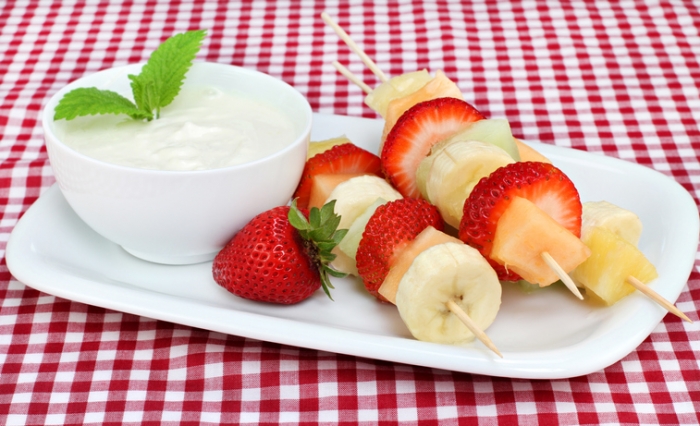 Greek Yogurt Fruit Dip Healthy fresh fruit on kabobs with a side yogurt dip.