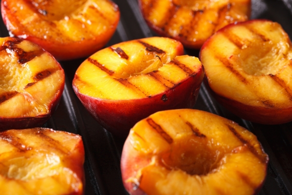 Fresh peaches on a grill.