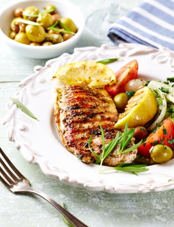 Grilled turkey fillet with grilled lemon and salad