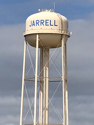 A zoomed in shot of the water tower in Jarrell, Texas